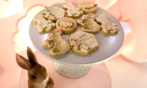 Assorted hand-iced cookies with bunny shapes and delicate floral accents