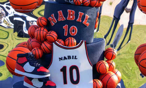 Basketball-themed birthday cake with custom jersey design and number 10 detail.