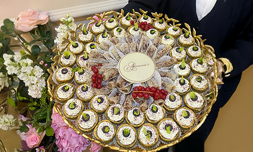 assortment of salty bites, including zaatar pies, tarts and musakhan roles.
